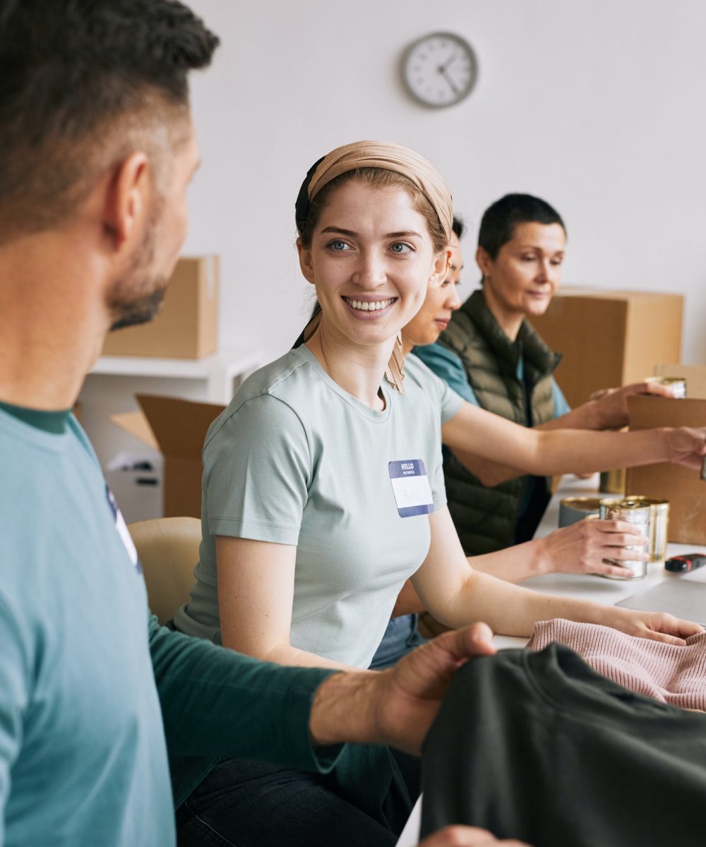 smiling-volunteers-in-donations-center.jpg